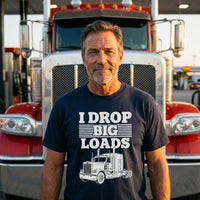 Load image into Gallery viewer, Man wearing I Drop Big Loads t-shirt standing in front of his big rig at a truck stop