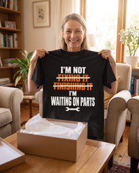 Load image into Gallery viewer, Woman holding up the Waiting On Parts shirt as a gift