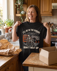 Load image into Gallery viewer, Woman holding up the I'll Be In The Garage shirt as a gift