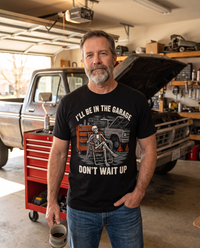 Load image into Gallery viewer, Man wearing the I'll Be In The Garage shirt in his garage