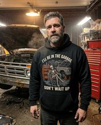 Load image into Gallery viewer, Man wearing the I'll Be In The Garage hoodie in his garage