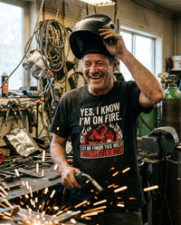 Load image into Gallery viewer, Welder wearing the Yes I Know I'm On Fire shirt